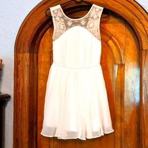 Classy white dress with embroidered beads